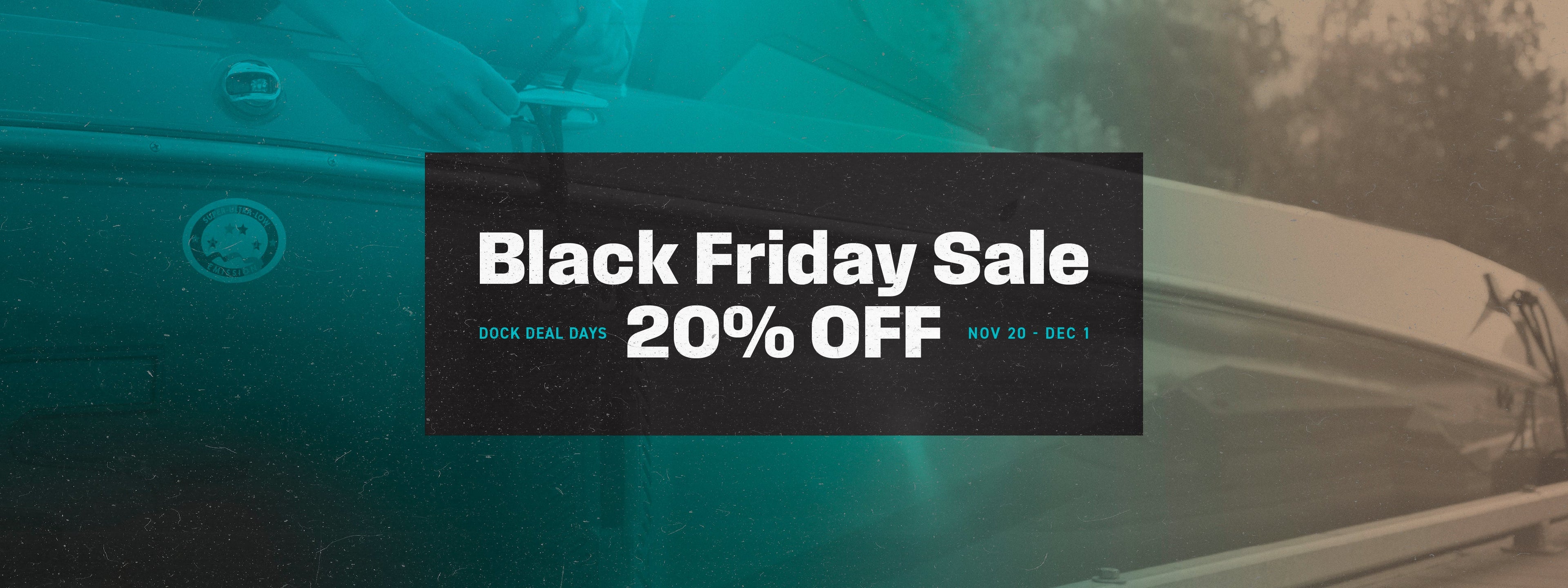 Sleek modern boat with Seipel Marine side bumpers floating on a calm lake with rugged cliffs in the background.