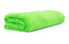 Green microfiber towel folded with white background.