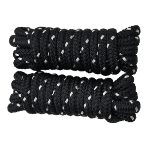 Top view of two coiled black dock lines with white accents, neatly wound with looped ends.