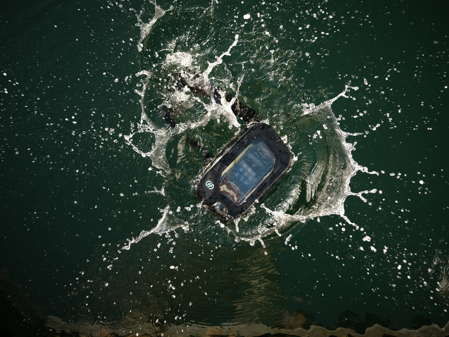 Top view of Hip Pack splashing in water, demonstrating waterproof protection for stored phone.