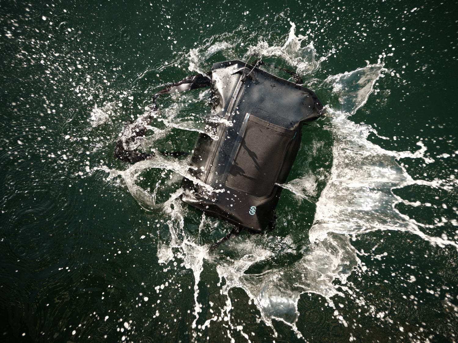 Top view of Backpack floating in water, demonstrating waterproof construction and sealed zipper.