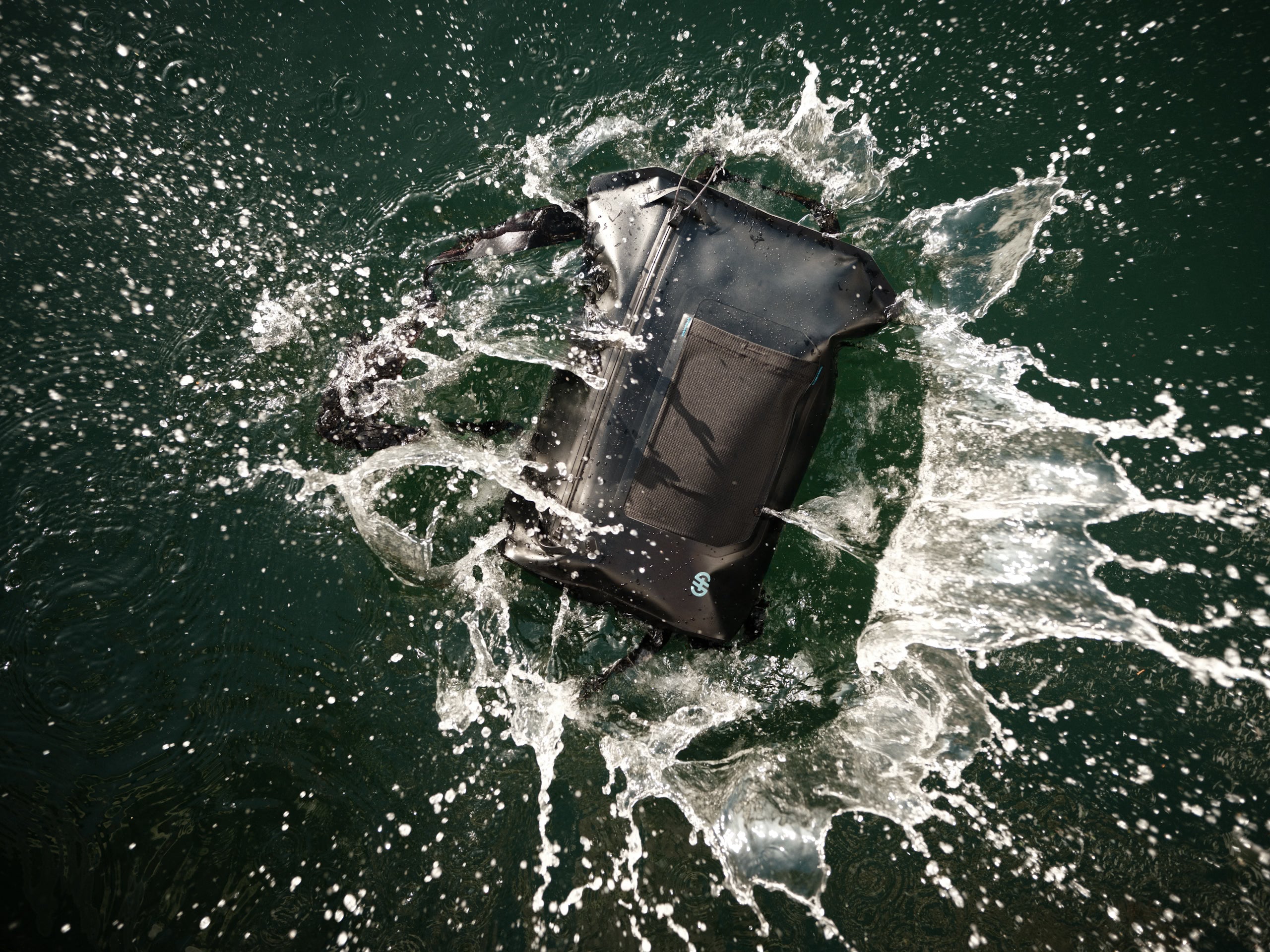 Top view of Backpack floating in water, demonstrating waterproof construction and sealed zipper.
