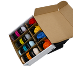 Open box showing four Seipel Marine cleaner bottles and rolled plush towels in red, blue, yellow, and orange.